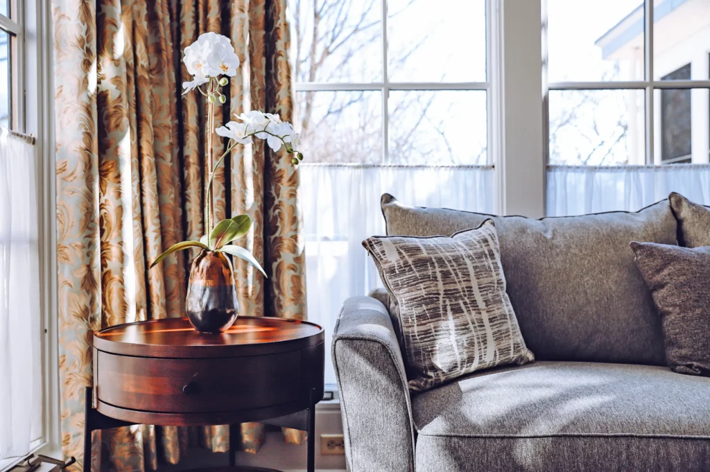 A comfortable grey sofa and elegant orchid arrangement highlight these Milford, PA accommodations.