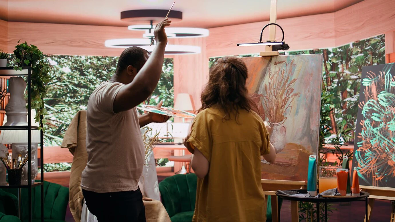 Two artists paint together during one of the creative community events in Milford, PA.
