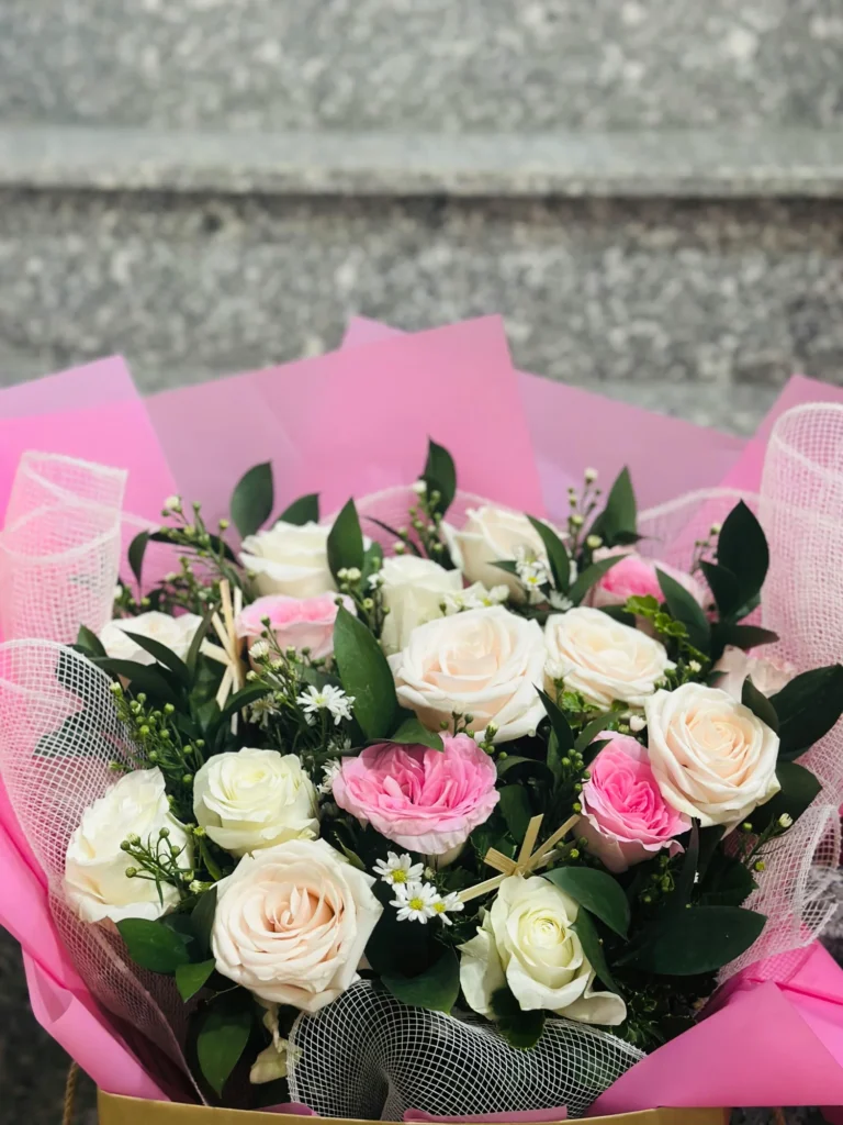 A lush bouquet of pink and white roses captures the romance of our Milford wedding venues.