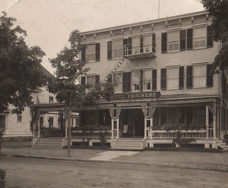 A vintage sepia photograph shows the historic exterior and wrap-around porch of Hotel Fauchère in Milford, PA.
