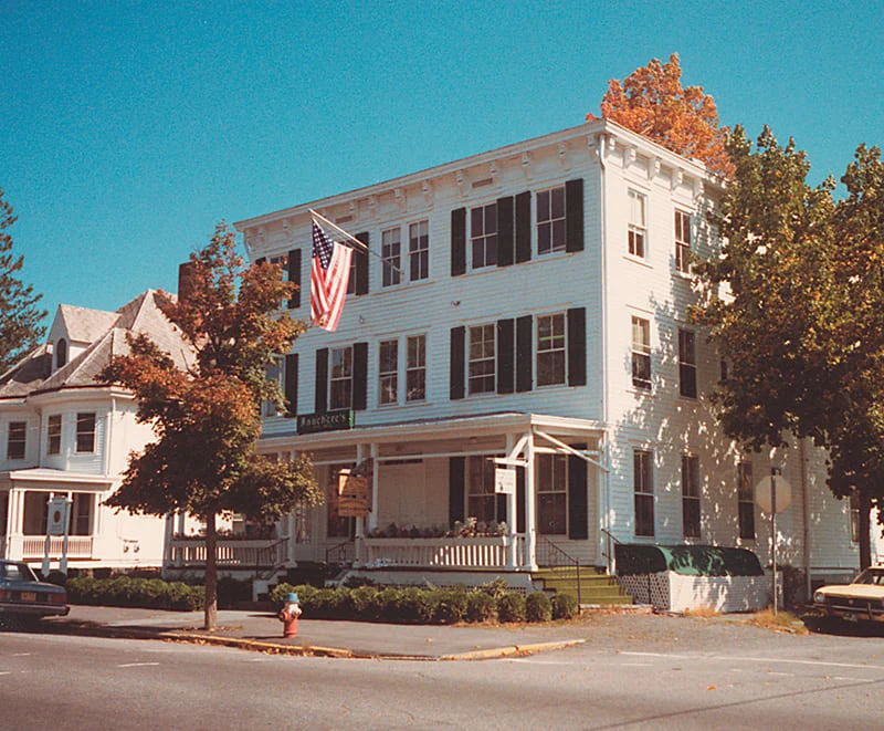 The white clapboard exterior of Hotel Fauchère, a classic choice for Milford PA hotels in the historic district.