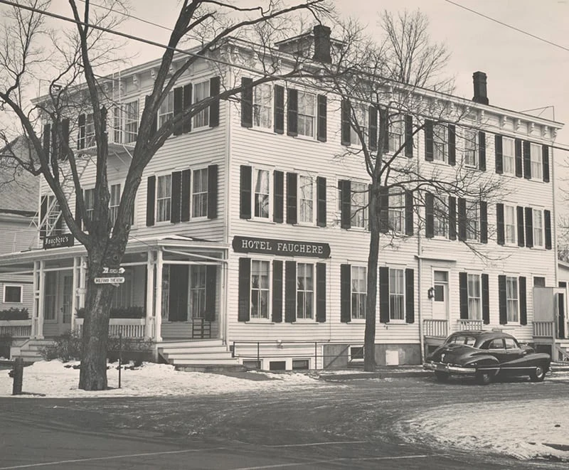 A black and white vintage photo of Hotel Fauchère within the Milford historic district during winter.