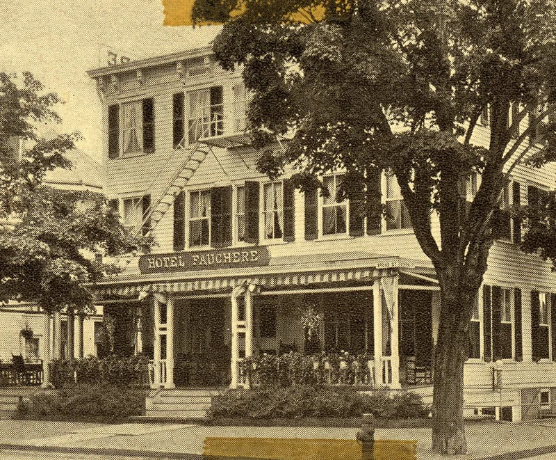 A vintage sepia-toned photograph of the historic Hotel Fauchère building and grand porch in Milford, PA.