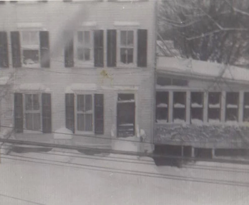 Snow blankets the facade of Hotel Fauchère in the heart of the Milford historic district.