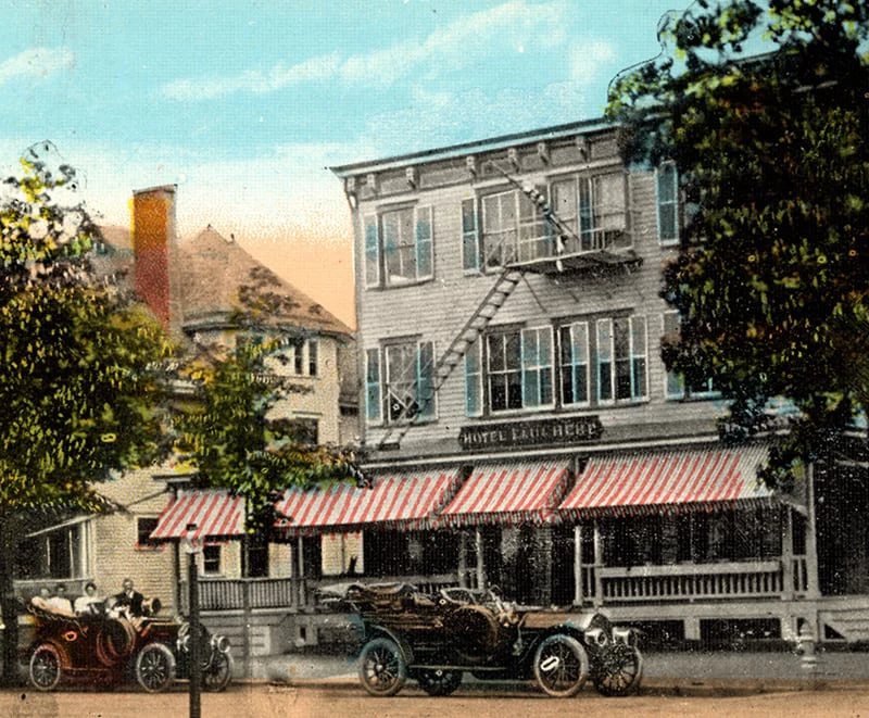 A vintage postcard shows the Hotel Fauchère facade with antique cars in the Milford historic district.