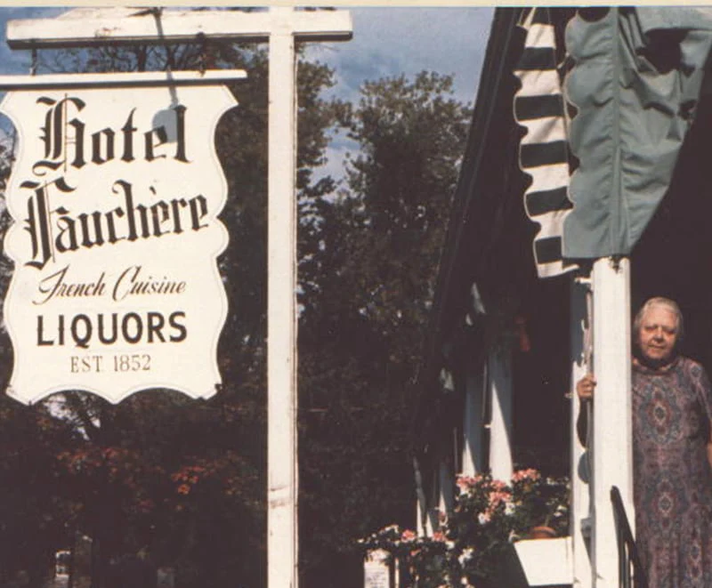 A vintage sign at Hotel Fauchère showcases its long history as a landmark in the Milford historic district.