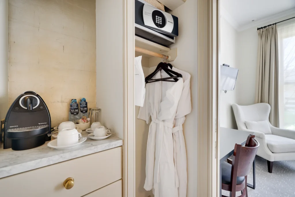 A coffee station and plush robes provide comfort at this luxury Milford historic district hotel.