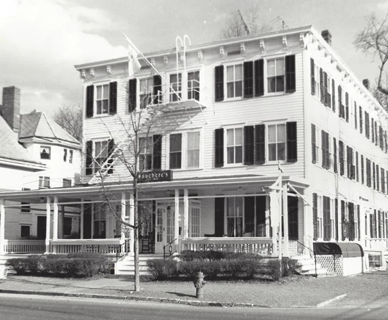 a black and white photo of a large building